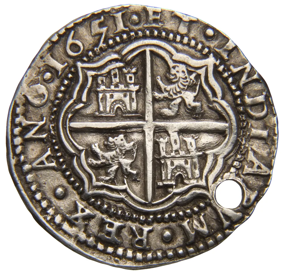 Reverse of the same hammered coin, a cross with castles and lions alternating in the four angles, the date 1651 above