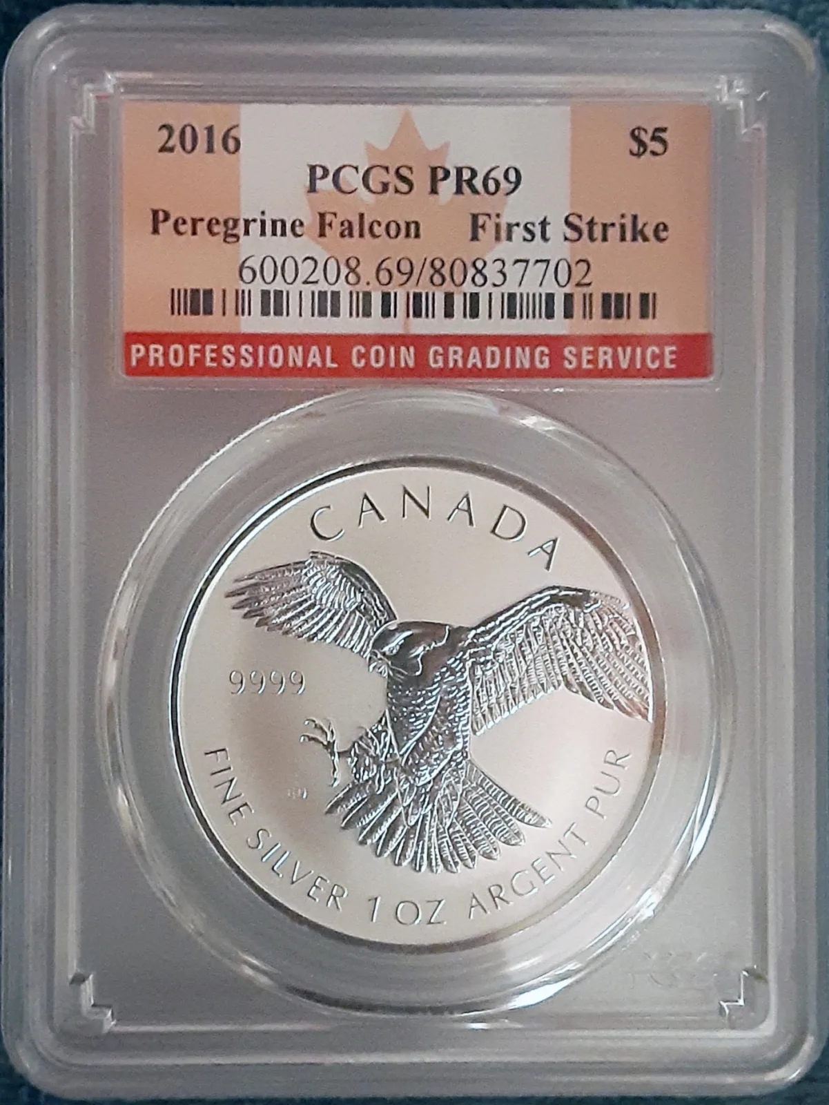 A silver coin sealed in a PCGS grading holder with a printed label giving the grade and certification number
