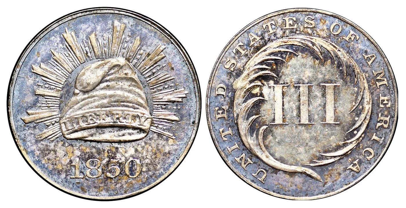 Obverse and reverse of an 1850 three cent silver pattern showing a rayed Liberty cap instead of the star that was adopted
