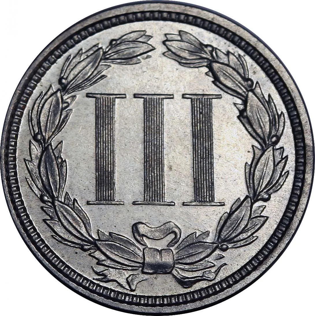 Reverse of an 1871 proof nickel three cent piece showing the Roman numeral III inside an open laurel wreath tied with a ribbon