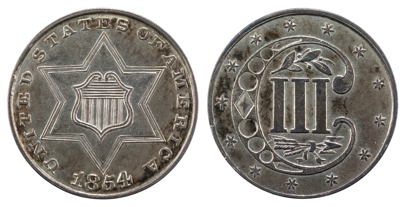 Obverse and reverse of an 1854 Type 2 silver trime, with three lines outlining the star and an olive sprig above and arrows below the III