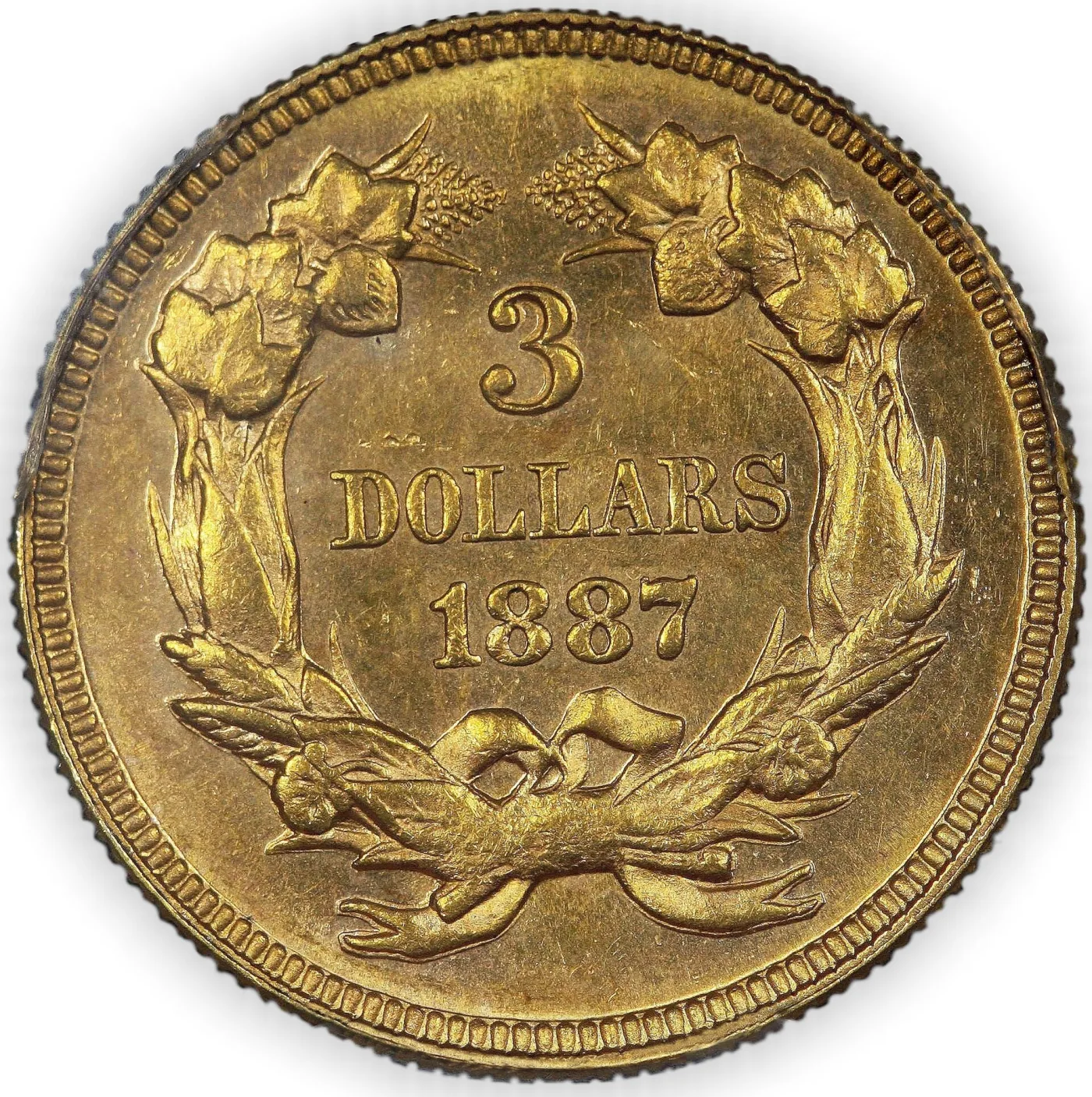 Reverse of an 1887 Three Dollar Gold piece with wreath leaves, corn ears, wheat awns and bow knot fully detailed