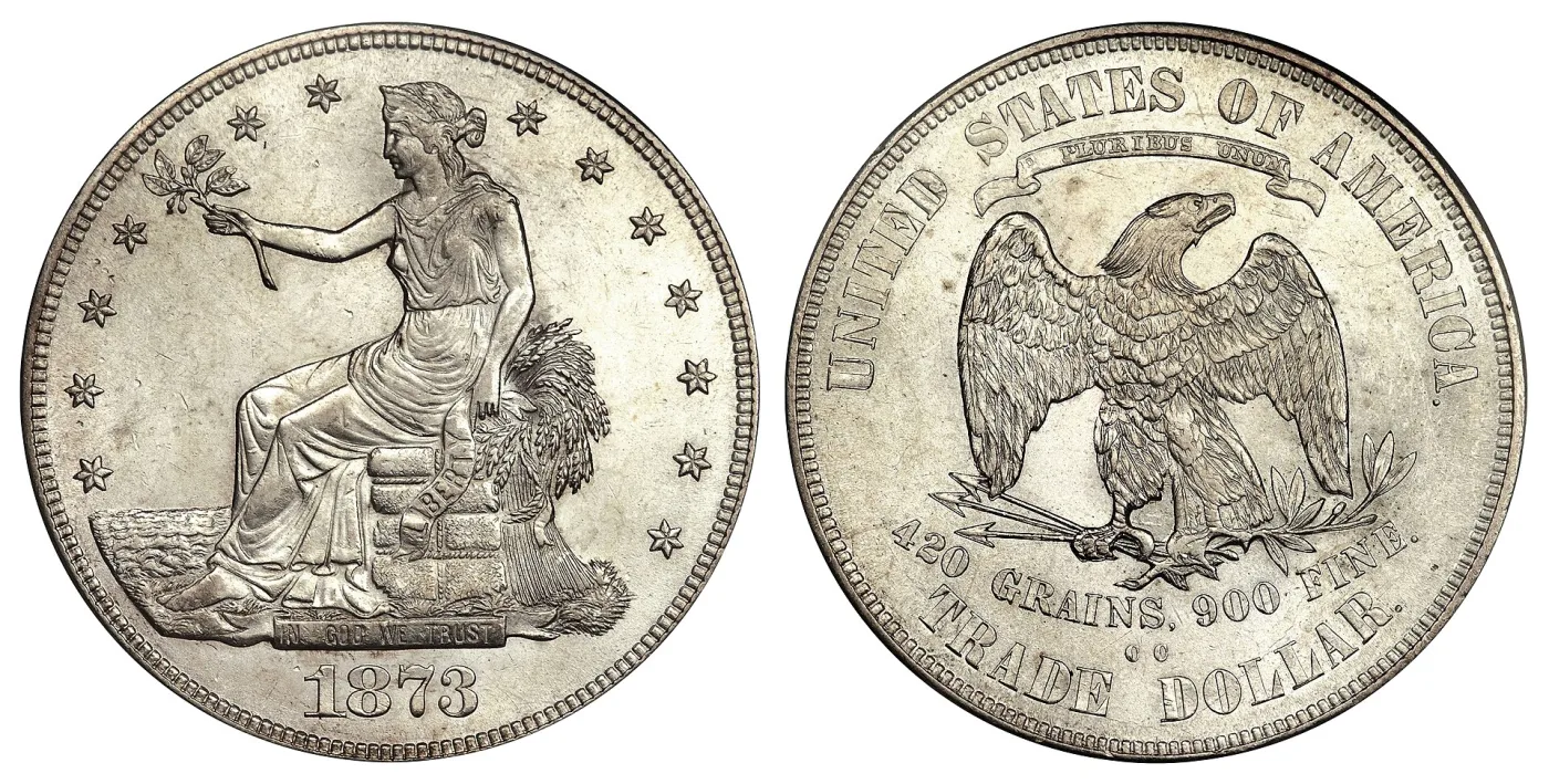 Obverse and reverse of an 1873-CC Trade Dollar, the reverse reading 420 GRAINS, 900 FINE above TRADE DOLLAR with the CC mint mark between them
