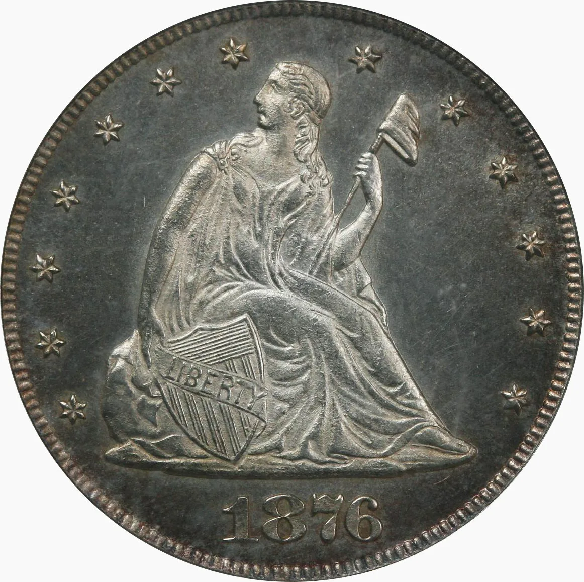 Obverse of an 1876 Philadelphia proof twenty cent piece, the mirrored field photographing dark against the pale frosted seated figure